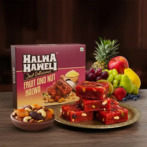 Fruit and nut halwa pieces on a plate with mixed nuts and fruits