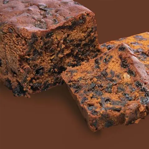 slice of fruit cake with nuts and dried fruits