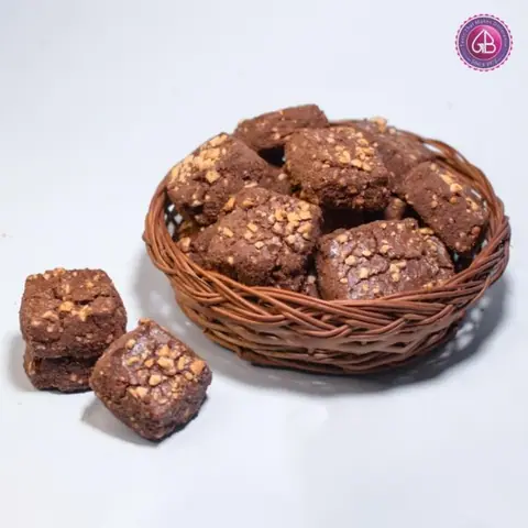 Chocolate brownies with nuts in a wicker basket