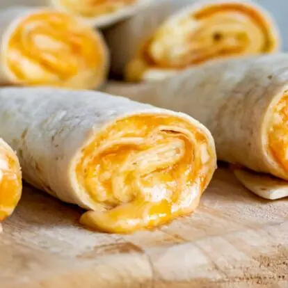 Close-up of rolled flatbread stuffed with spiced paneer filling