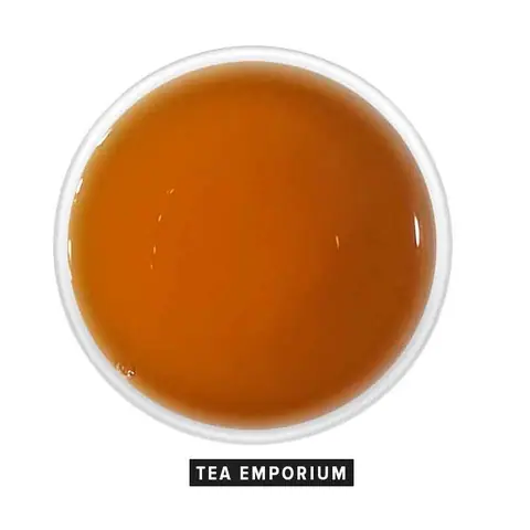 Top view of a cup of Darjeeling tea with rich amber color