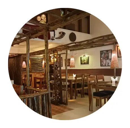 Wooden rustic interior seating area with tables and chairs