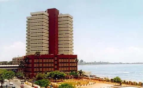 Exterior view of Hotel Metro Palace building near the waterfront in Mumbai