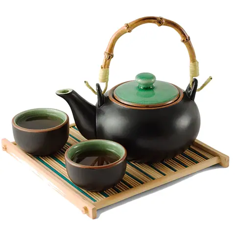 Black teapot with green lid and two matching cups on bamboo tray