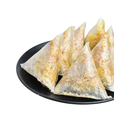 Plate of stuffed samosas with crispy golden crust