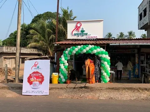Exterior view of Shree Amruttulya cafe with green and white balloon decoration