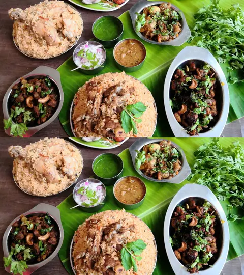 Two plates of chicken biryani with side dishes and green chutney on a banana leaf