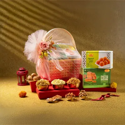 Assorted Indian sweets and snacks gift box with dry fruits and decorative packaging