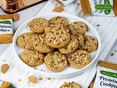 Plate of almond-topped premium cookies from Pista House