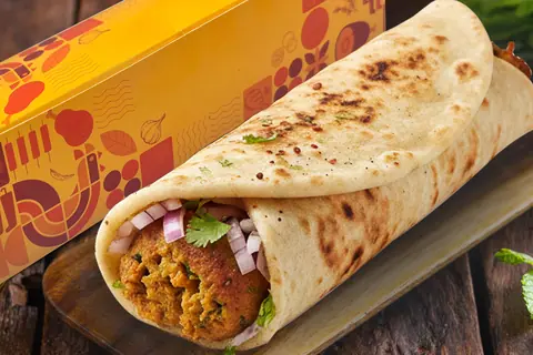 Kebab wrap with onions and coriander in a flatbread