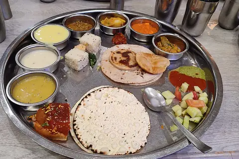 Representative photo of gujarati food, not Ghoomar Traditional Thali - Hush Food Mall's own